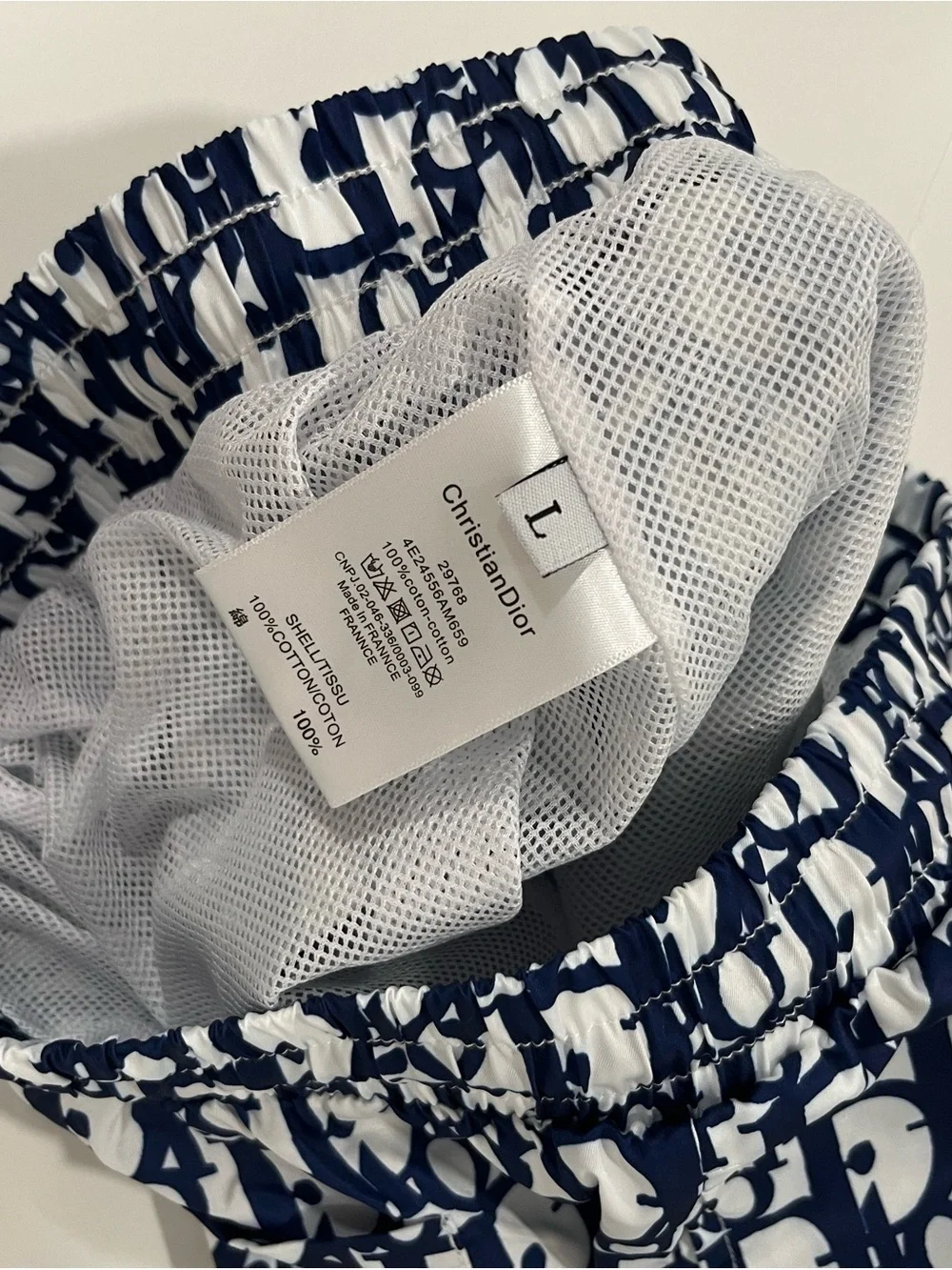 DlOR swim trunks blue and white